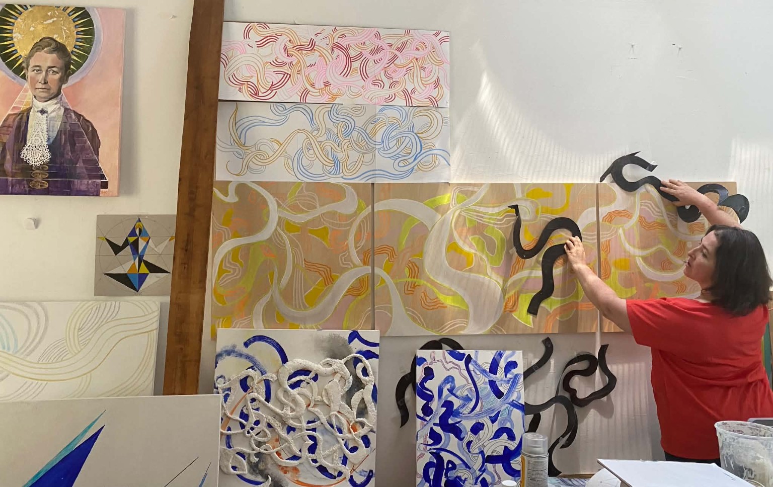 Natalia Koren working among artworks