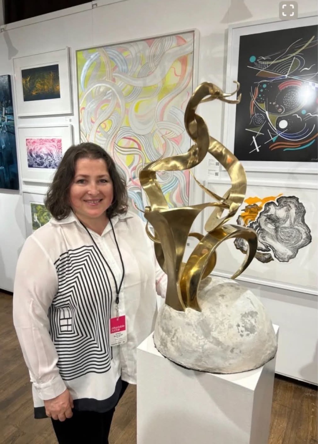 Natalia Koren with sculptural work at exhibition